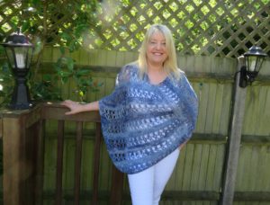 Ocean Kiss Crochet Poncho Pattern from Crochet247 featuring Lion Brand Shawl in a Ball