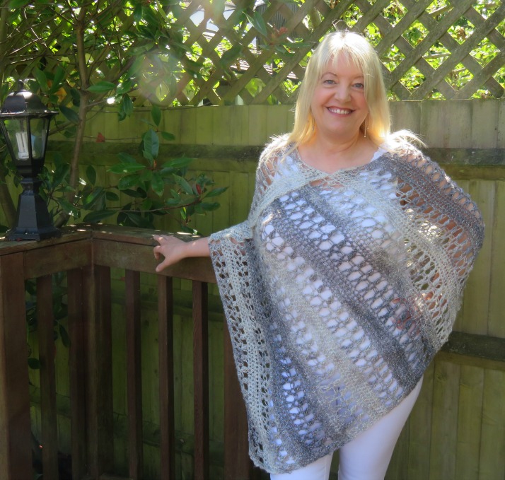 Ocean Kiss Crochet Poncho Pattern from Crochet247 featuring Lion Brand Shawl in a Ball